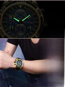 Close-up of luminous watch hands and markers with model wearing sporty chronograph watch