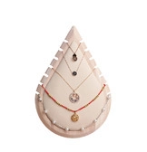 Detail of drop-shaped jewelry display stand with multiple slots for necklaces and bracelets