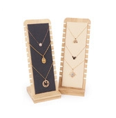 Detail view of wooden necklace display stands with premium grey and beige velvet lining