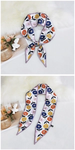 Detail of floral skinny silk scarf with colorful daisy patterns and purple edge trim