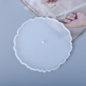Macro view of translucent round silicone mold with wavy edges for resin DIY coasters