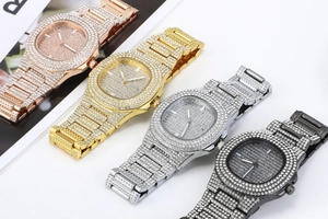 Detailed lineup of four full diamond quartz watches in rose gold, gold, silver, and black
