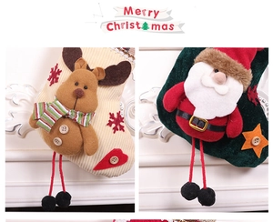 Detail of Christmas stocking decorations with 3D Reindeer and Santa Claus velvet designs