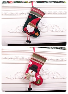 Detail of Christmas stockings with 3D Santa and Snowman designs and knit patterns