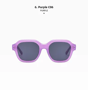 Close-up of purple translucent frame sunglasses with silver rivet accents and grey lenses