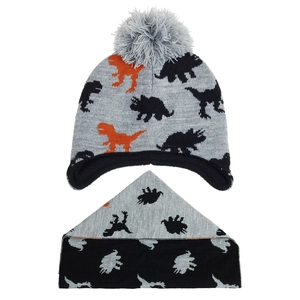 Close-up of kids dinosaur knit hat and scarf set with pompom and ear protection