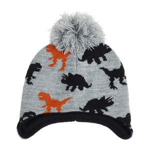 Close-up of kids dinosaur knit hat with ear flaps and plush pompom for winter