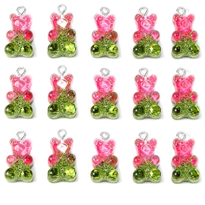 Sparkly resin gummy bear pendants with pink and green glitter for DIY jewelry making