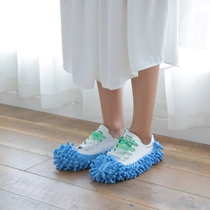 Washable blue chenille mop slippers cover on white canvas shoes for floor cleaning