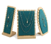 Three premium wood and green velvet display stands for luxury necklace and pendant showcase
