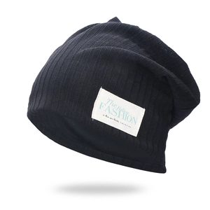 Classic black ribbed knit beanie with stylish white fabric label for daily wear