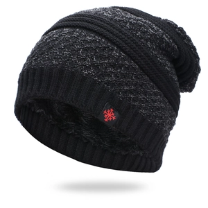Detail view of winter knit beanie showing thick black fleece lining and diamond pattern weave