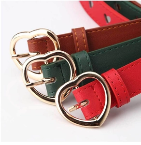Detail shot of heart-shaped gold buckles on high-quality red, green and brown PU leather belts