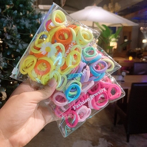 Macro detail of colorful high-elastic hair bands in transparent zipper bags