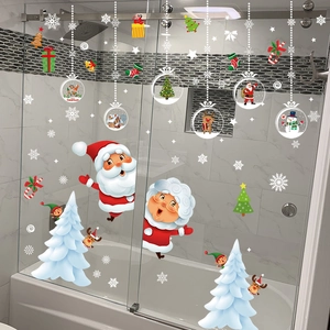 Detail view of Santa Claus and snowflake static window stickers on a glass shower door