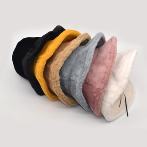 Detailed view of plush faux mink fur bucket hats in multiple solid colors for winter