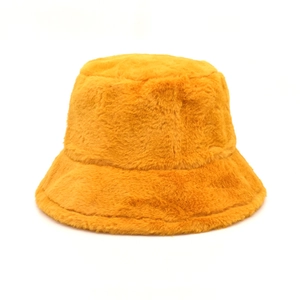 Close-up of bright yellow faux mink fur fisherman hat showing soft plush texture