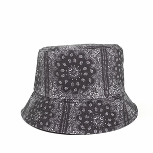 Close-up of black and white paisley bucket hat made from durable cotton canvas material