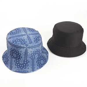 Double-sided paisley print and solid black canvas bucket hat for sun protection