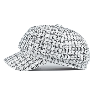 Classic black and white tweed newsboy cap with vintage check pattern for women