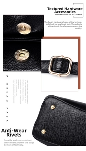 Detailed view of pale gold magnetic clasp and protective bottom rivets on black leather bucket bag