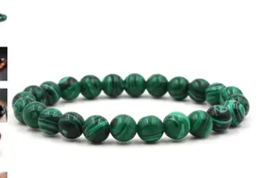 Green malachite beaded bracelet with black wave patterns on polished round tiger eye stones