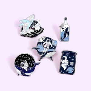 5-piece enamel pin set featuring cartoon whales and astronauts in dreamy space themes