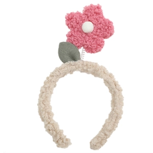 Cute teddy fleece headband featuring a pink plush flower with a spring and green leaf detail