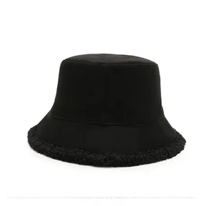 Back view of black bucket hat featuring fleece trim detail on a clean white background
