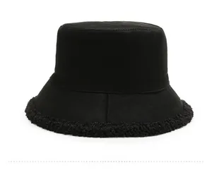 Side view of black winter bucket hat featuring cozy faux fur trim and twill fabric texture