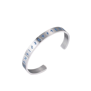 Titanium steel Viking cuff bracelet with blue luminous runes in a 45-degree angle view