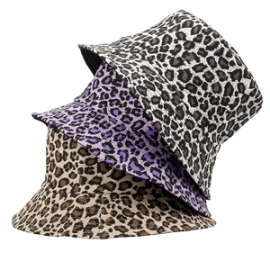 Multi-colored leopard print bucket hats in brown, purple and grey on white background