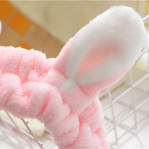 Pink and white plush rabbit ear headband for face washing and makeup soft hair accessory
