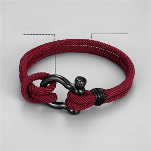 Detail of burgundy braided Milan rope bracelet with black plated horseshoe clasp