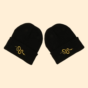 Winter black knit beanie for men and women featuring detailed golden snake embroidery