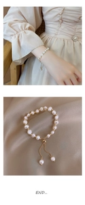 Detail of baroque pearl bracelet with 14K gold plated beads on silk background