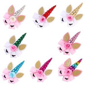 Detailed grid view showing eight styles of unicorn hair clips with plush velvet bows