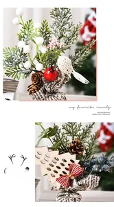 Close-up of Christmas mini potted plant with red berries pine cones and linen base