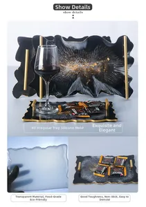 Detail of irregular resin tray mold with golden handle and feather texture finish