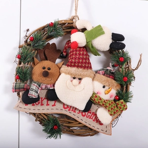 Christmas wreath with reindeer Santa and snowman figurines on a brown branch ring