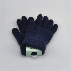Detail of navy blue knitted winter gloves for kids with elastic ribbed cuffs on white background