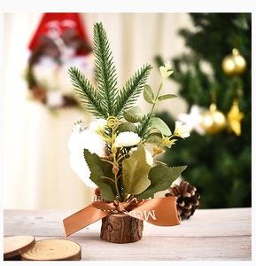 Mini Christmas tree with cotton and eucalyptus on a rustic wood base with ribbon