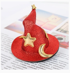 Detail of red sequined mini witch hat with gold star and moon patterns for Halloween