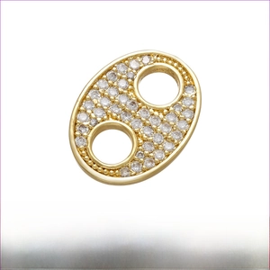 Detailed view of gold brass floral connector with zircon micro-pave for DIY jewelry