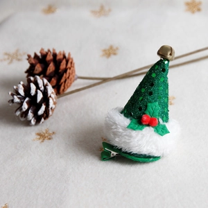 Christmas tree hat hair clip with green sequins, red berries and gold bells on snowflakes
