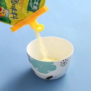 Yellow food sealing clip with pouring spout for airtight bag storage and kitchen convenience