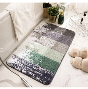 Detail of soft striped flocked bath mat with non-slip texture on marble floor