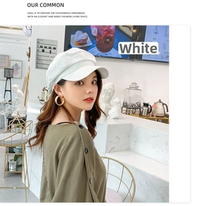 Close-up of a stylish white octagonal newsboy hat in breathable cotton for women