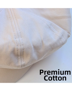 Detail view of beige cotton octagonal hat showing twill texture and neat double stitching