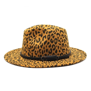 Detailed view of leopard print fedora hat featuring black leather band and metal buckle